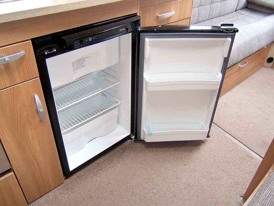 View of the fridge with freezer top box interior.